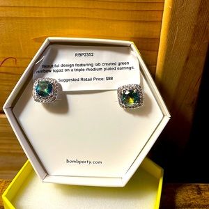 Lab created green rainbow topaz. Suggested retail $88.00